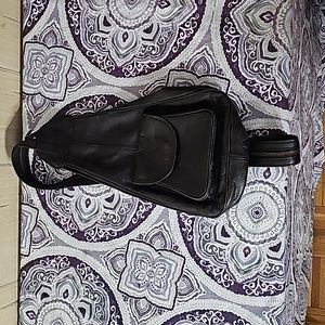 Vintage leather side back pack.